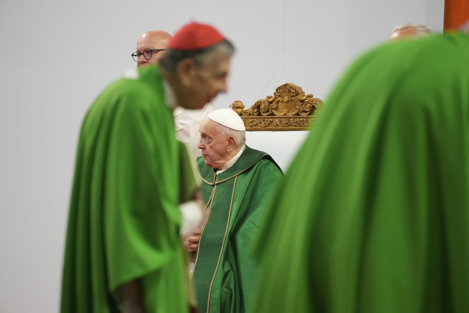 Pope Francis, second from right, prepares to preside over a mass at the Steppe Arena in the Mongolian capital Ulaanbaatar, Sunday, Sept. 3, 2023. Francis is in Mongolia to minister to one of the world's smallest and newest Catholic communities. Neighboring China's crackdown on religious minorities has been a constant backdrop to the trip, even as the Vatican hopes to focus attention instead on Mongolia and its 1,450 Catholics. (AP Photo/Andrew Medichini)