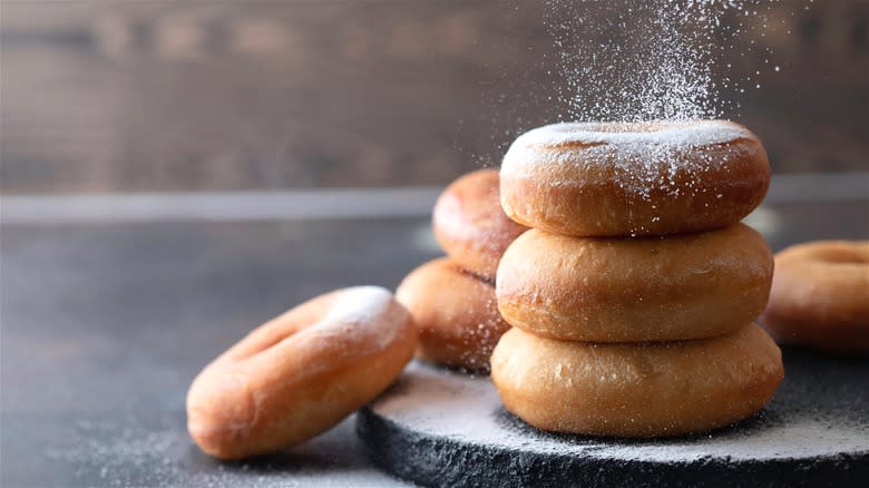 Stack of donuts with powdered sugar 