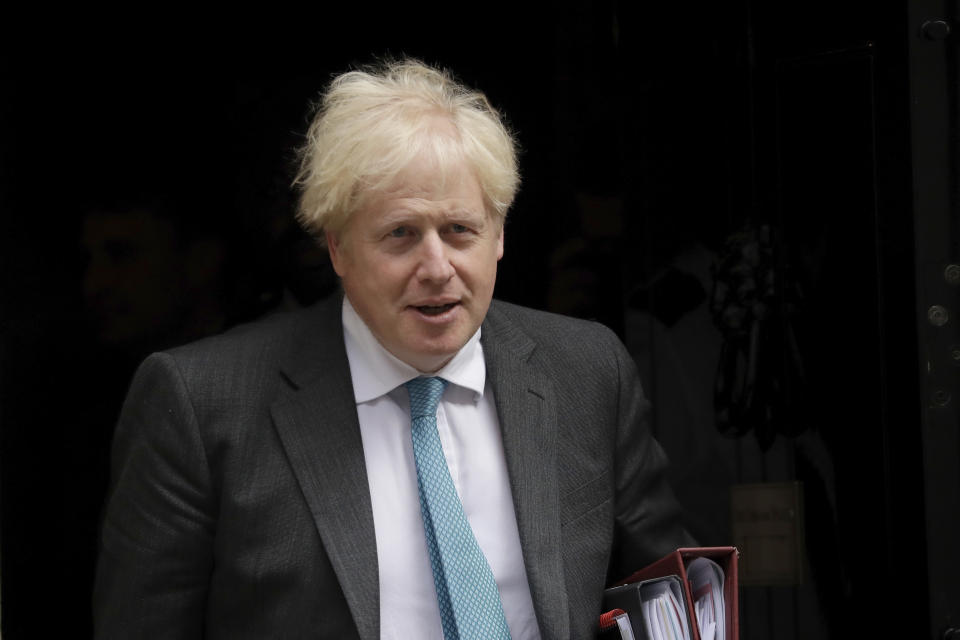 British Prime Minister Boris Johnson leaves 10 Downing Street in London, to attend the weekly Prime Minister's Questions at the Houses of Parliament, in London, Wednesday, Sept. 16, 2020. (AP Photo/Matt Dunham)