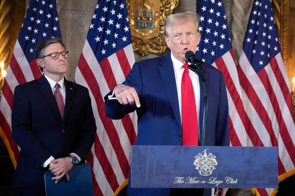  Donald Trump speaks as Speaker of the House Mike Johnson, R-La., listens (Wilfredo Lee / AP)