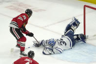 Toronto Maple Leafs goaltender Jack Campbell makes a save on a shot by Chicago Blackhawks' Brandon Hagel during an overtime period of an NHL hockey game Wednesday, Oct. 27, 2021, in Chicago. The Maple Leafs won 3-2. (AP Photo/Charles Rex Arbogast)