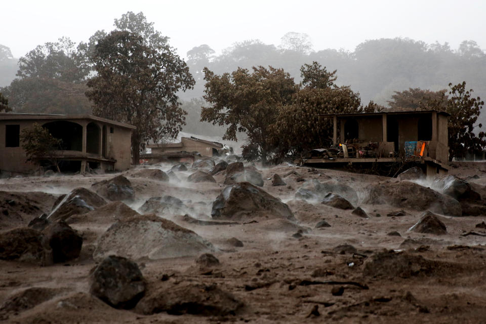 <p>Volcanic rocks are spread around an area that got buried after the eruption of the Fuego volcano at San Miguel Los Lotes in Escuintla, Guatemala, June 6, 2018. (Photo: Carlos Jasso/Reuters) </p>