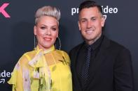 <p>The "So What" singer didn't waste time waiting for her motocross star beau to <a href="https://people.com/celebrity/pink-marries-boyfriend-in-costa-rica/" rel="nofollow noopener" target="_blank" data-ylk="slk:pop the question;elm:context_link;itc:0;sec:content-canvas" class="link ">pop the question</a> first. In fact, she chose a moment that may not have been the most convenient for Hart: while he was competing in the 2005 Pro 250 class finals in Mammoth, California, </p> <p>As Hart turned into his third lap of the race, she showed him a pit board reading, "Will You Marry Me?" When he kept on driving, Pink held up another sign that said, "I'm serious!" Her clarification worked, too, because her now-husband halted his motorcycle to accept.</p>