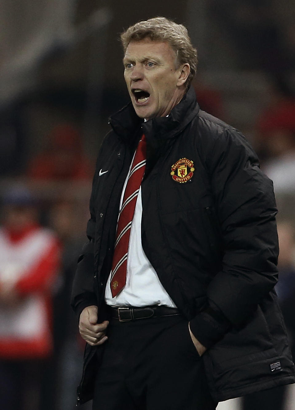 Manchester United's coach David Moyes gives instructions to his players during a Champions League, round of 16, first leg soccer match against Olympiakos at Georgios Karaiskakis stadium, in Piraeus port, near Athens, on Tuesday, Feb. 25, 2014. (AP Photo/Petros Giannakouris)