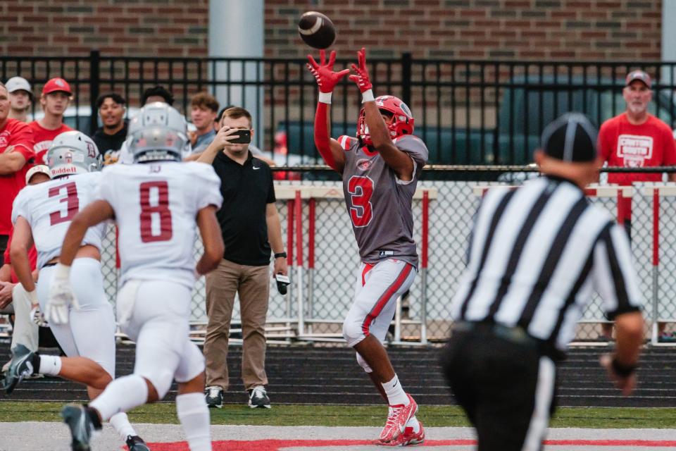 Canton South's Tavon Castle makes a touchdown catch against Dover, Friday, Aug. 25, 2023.