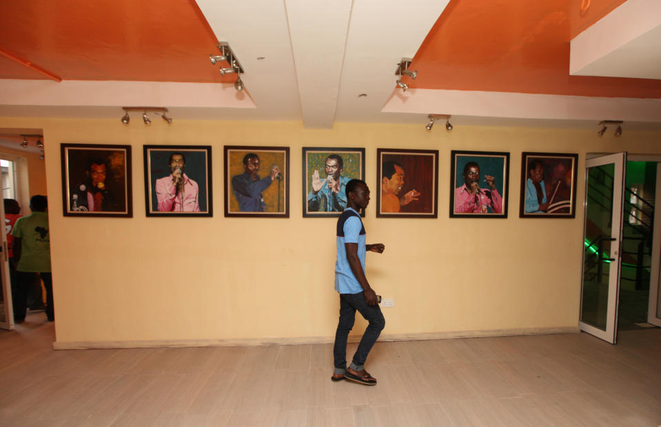 A man walks past portraits of late Afrobeat Legend Fela Kuti, at Kalakuta Museum in Lagos, Nigeria, on Monday, Oct. 15, 2012. The family of late Afrobeat singer Fela Anikulapo-Kuti celebrated the opening of the Kalakuta Museum on Monday in Lagos in the home the musician once lived in. The opening of the museum comes during Felabration, an annual music festival honoring the singer. (AP Photo/Sunday Alamba)