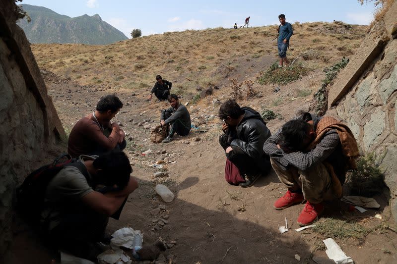 Migrants from Afghanistan hide from security forces after crossing illegally into Turkey from Iran, near Tatvan