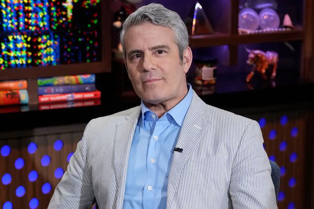 <p>Charles Sykes/Bravo via Getty</p> Andy Cohen poses for a photo on the set of "Watch What Happens Live"