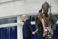 President Donald Trump holds first lady Melania Trump's hand as they visit Saint John Paul II National Shrine, Tuesday, June 2, 2020, in Washington. (AP Photo/Patrick Semansky)