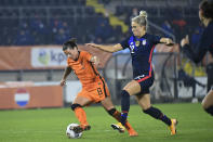 Netherlands' Sherida Spitse, left, and United States Kristie Mewis vie for the ball during the international friendly women's soccer match between The Netherlands and the US at the Rat Verlegh stadium in Breda, southern Netherlands, Friday Nov. 27, 2020. (Piroschka van de Wouw/Pool via AP)