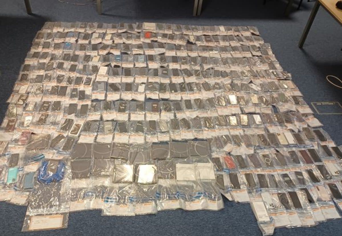 Hundreds of phones were found, some wrapped in foil  (Metropolitan Police)