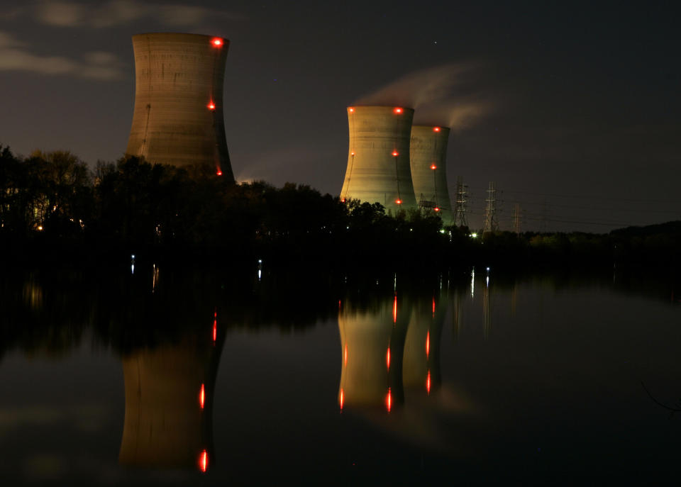 FILE - In this Nov. 2, 2006 file photo, cooling towers of the Three Mile Island nuclear power plant are reflected in the Susquehanna River in this time exposure photograph in Middletown, Pa. With nuclear power plant owners seeking a rescue in Pennsylvania, a number of state lawmakers are signaling that they are willing to help, with conditions. Giving nuclear power plants what opponents call a bailout could mean a politically risky vote to hike electric bills. (AP Photo/Carolyn Kaster, File)