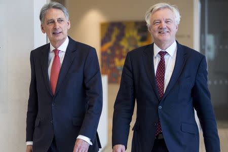 Britain's Chancellor of the Exchequer Philip Hammond (L) and the Secretary of State for Exiting the European Union David Davis arrive for a meeting with executives from the financial services at The Shard in London, December 5, 2016. REUTERS/Jack Taylor/Pool