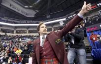 Will Ferrell as Ron Burgundy salutes the crowd at the Roar of the Rings Canadian Olympic Curling Trials in Winnipeg, Manitoba December 1, 2013. REUTERS/Trevor Hagan (CANADA - Tags: SPORT ENTERTAINMENT CURLING)