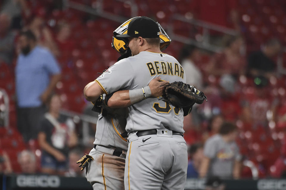 Pittsburgh Pirates catcher Michael Perez, left, celebrates with teammate Pittsburgh Pirates relief pitcher David Bednar after beating the St. Louis Cardinals in a baseball game Thursday, June 24, 2021, in St. Louis. (AP Photo/Joe Puetz)