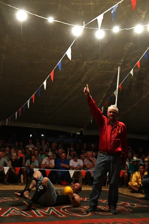 For Fred Brophy, shown here declaring the winner of a bout, having his own troupe is something of a family tradition