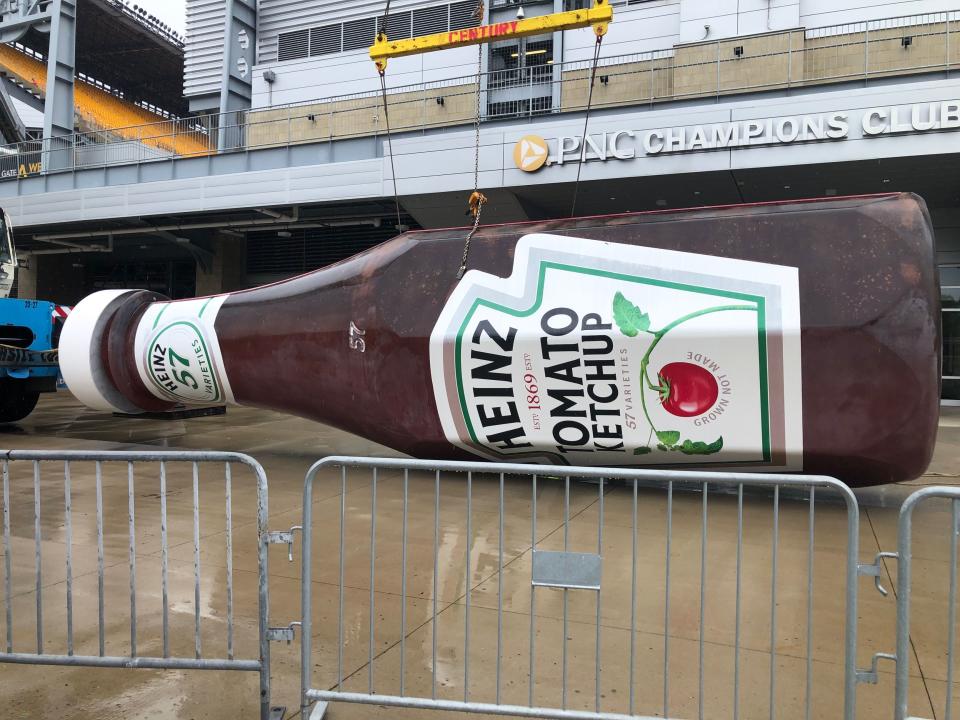 Crews have begun removing Heinz Field signage from the newly-named Acrisure Stadium.