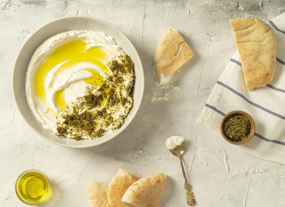 Hummus dip topped with za'atar spice blend and olive oil.
