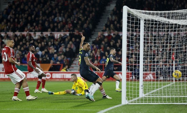 Bruno Guimaraes, background right, scores the opening goal