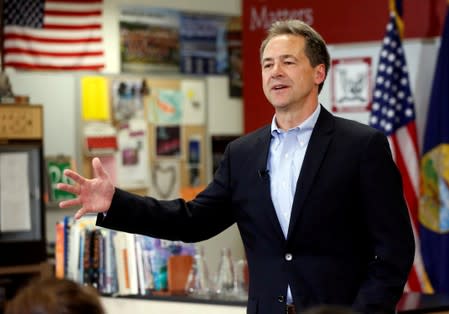 FILE PHOTO: Montana Governor Steve Bullock talks to the media and students at Helena High School as he launches 2020 U.S. presidential campaign in Helena, Montana