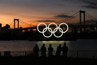 <p>TOKYO, JAPAN - AUGUST 04: A general view of the Olympic rings installation and Rainbow Bridge as the sun sets on day twelve of the Tokyo 2020 Olympic Games at Odaiba Marine Park on August 04, 2021 in Tokyo, Japan. (Photo by Clive Rose/Getty Images)</p> 