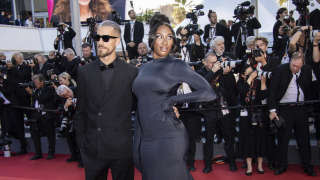 Aya Nakamura and Vladimir Boudnikoff pose for photographers upon arrival at the premiere of the film 'Armageddon Time' at the 75th international film festival, Cannes, southern France, Thursday, May 19, 2022. (Photo by Vianney Le Caer/Invision/AP)