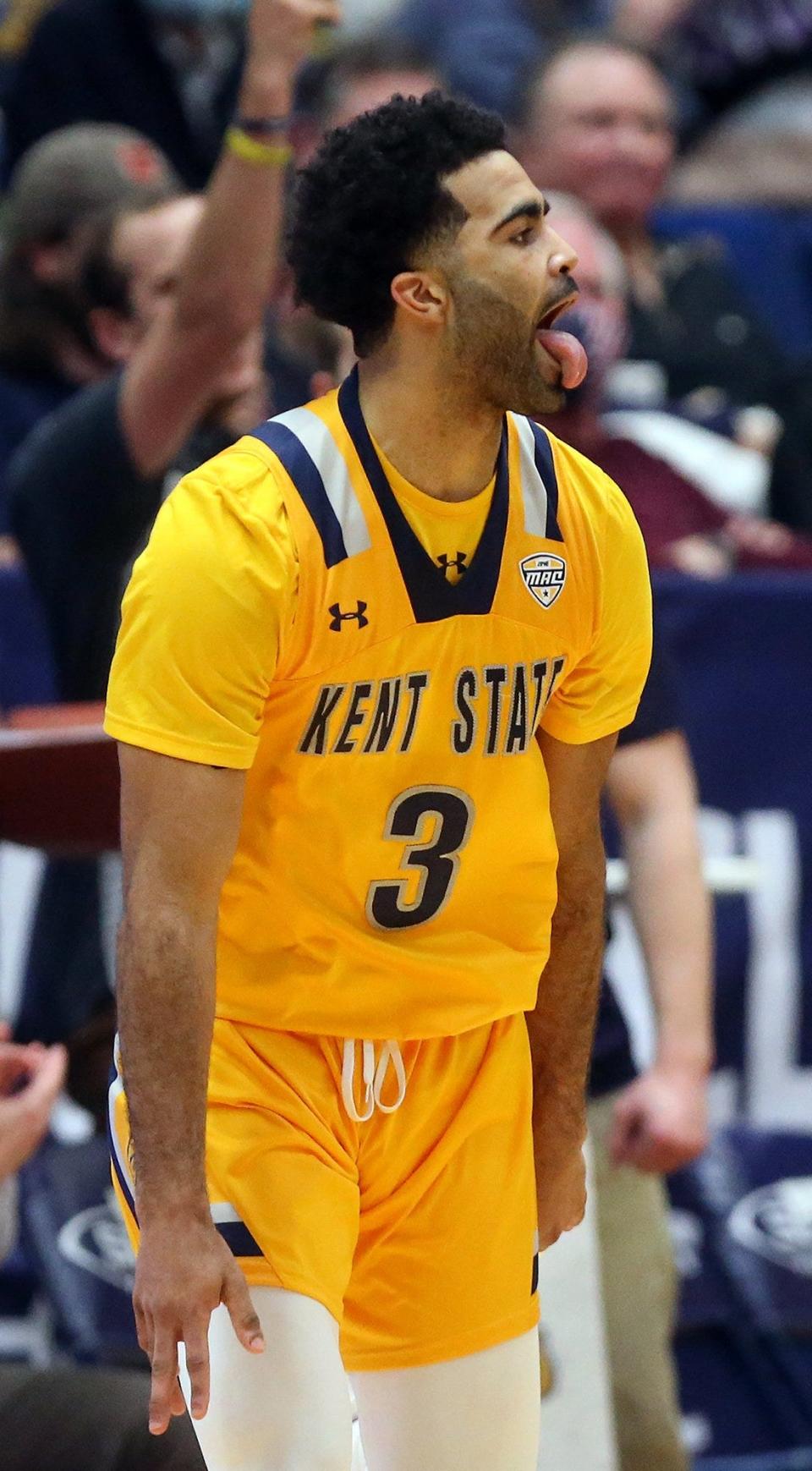 Kent State guard Sincere Carry (3) celebrates after knocking down a three during the second half of an NCAA basketball game against the Akron Zips, Friday, Feb. 11, 2022, in Akron, Ohio. [Jeff Lange/Beacon Journal]