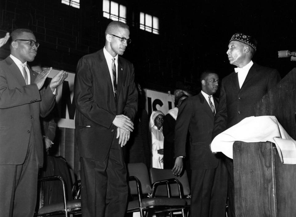 PHOTO: Elijah Muhammad, founder and head of the Nation of Islam, right, introduces Malcolm X in Chicago, Feb. 26, 1961. (Paul Cannon/AP, FILE)