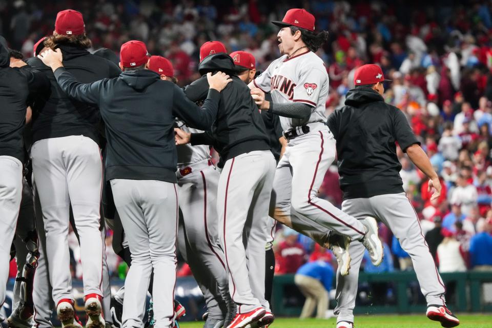 Arizona Diamondbacks left fielder Corbin Carroll (7) celebrates with teammates after defeating the Philadelphia Phillies in game seven of the NLCS at Citizens Bank Park in Philadelphia on Oct. 24, 2023.