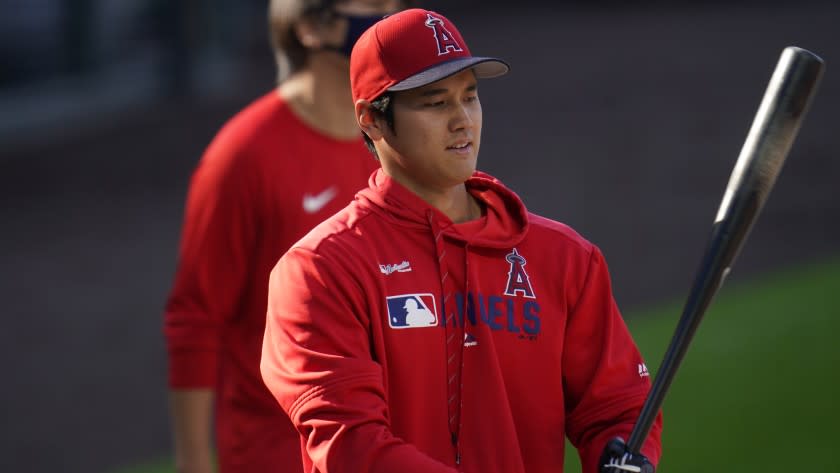 Los Angeles Angels designated hitter Shohei Ohtani (17) warms up before a baseball game against the Saturday, Sept. 12, 2020, in Denver. (AP Photo/David Zalubowski)