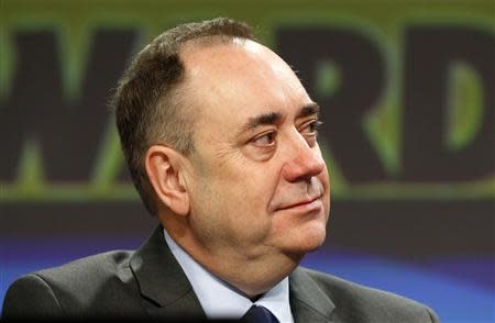 Scotland's First Minister Alex Salmond listens to Deputy First Minister Nicola Sturgeon's speech at the SNP Spring Conference in Aberdeen, Scotland April 11, 2014. REUTERS/Russell Cheyne