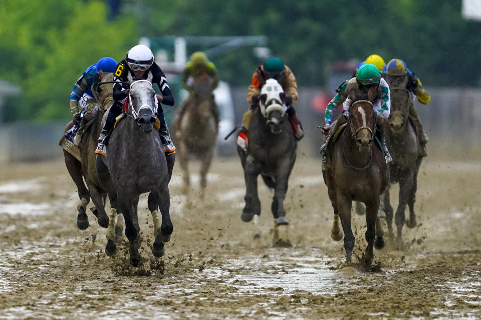 Jaime Torres, left, atop Seize The Grey, leads the pack while winning the Preakness Stakes horse race at Pimlico Race Course, Saturday, May 18, 2024, in Baltimore. (AP Photo/Nick Wass)