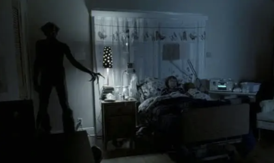 The ghost from "Insidious" pointing at Dalton as he sleeps