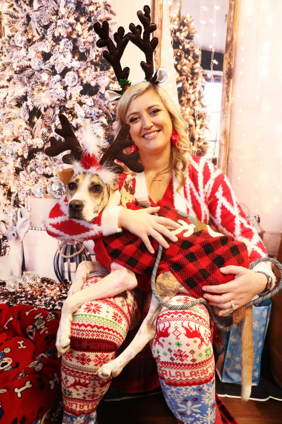 Riona, the dog set on fire by her owner a couple months ago has recovered and made her first appearance since the incident, decked out in Christmas attire at Hollywood Feed.