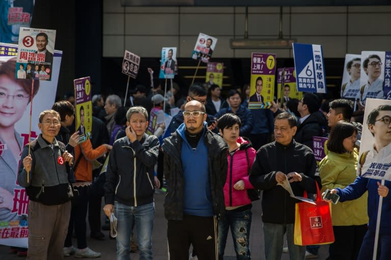 Supporters of various political groups campaign during the New Territories East by-election in Hong Kong, on February 28, 2016