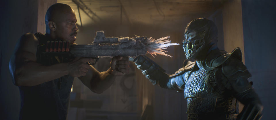 This image released by Warner Bros. Pictures shows Mehcad Brooks, left, and Joe Taslim in a scene from "Mortal Kombat." (Mark Rogers/Warner Bros. Pictures via AP)