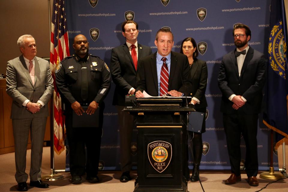 New Hampshire Attorney General John Formella speaks at a press conference on Tuesday, Jan. 17, 2023 at Portsmouth City Hall announcing civil rights charges against members of a white nationalist group that had displayed a hate message on a city overpass.