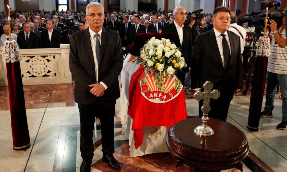 Men stand next to the coffin of former Cypriot president Christofias
