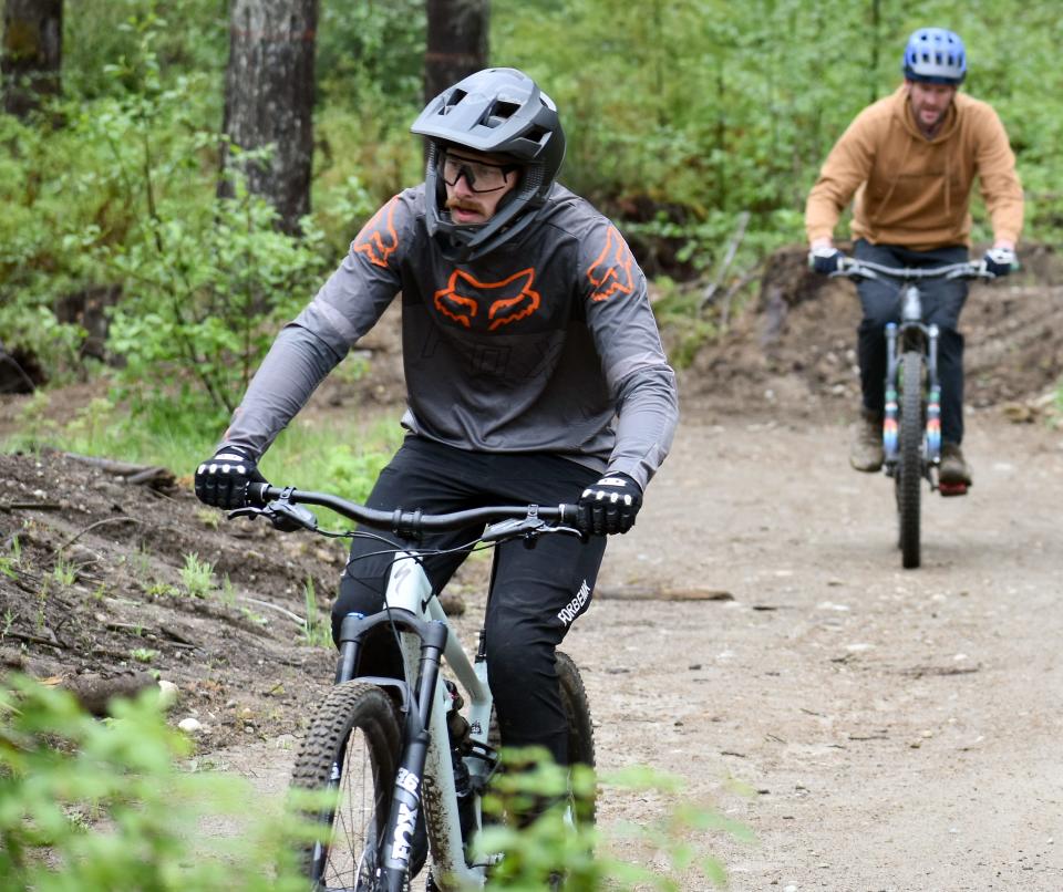 Isaac Gautschi, left, and Matt Blossom bike along one of Port Gamble Ride Park's many trails.