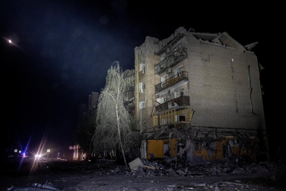 Rescue workers attend the site (REUTERS)