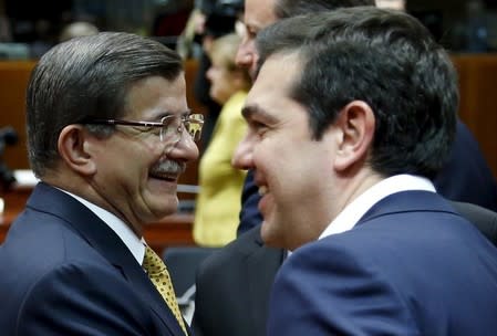 Turkish Prime Minister Ahmet Davutoglu and Greek counterpart Alexis Tsipras (R) attend a European Union leaders summit on migration in Brussels, Belgium, March 18, 2016. REUTERS/Francois Lenoir