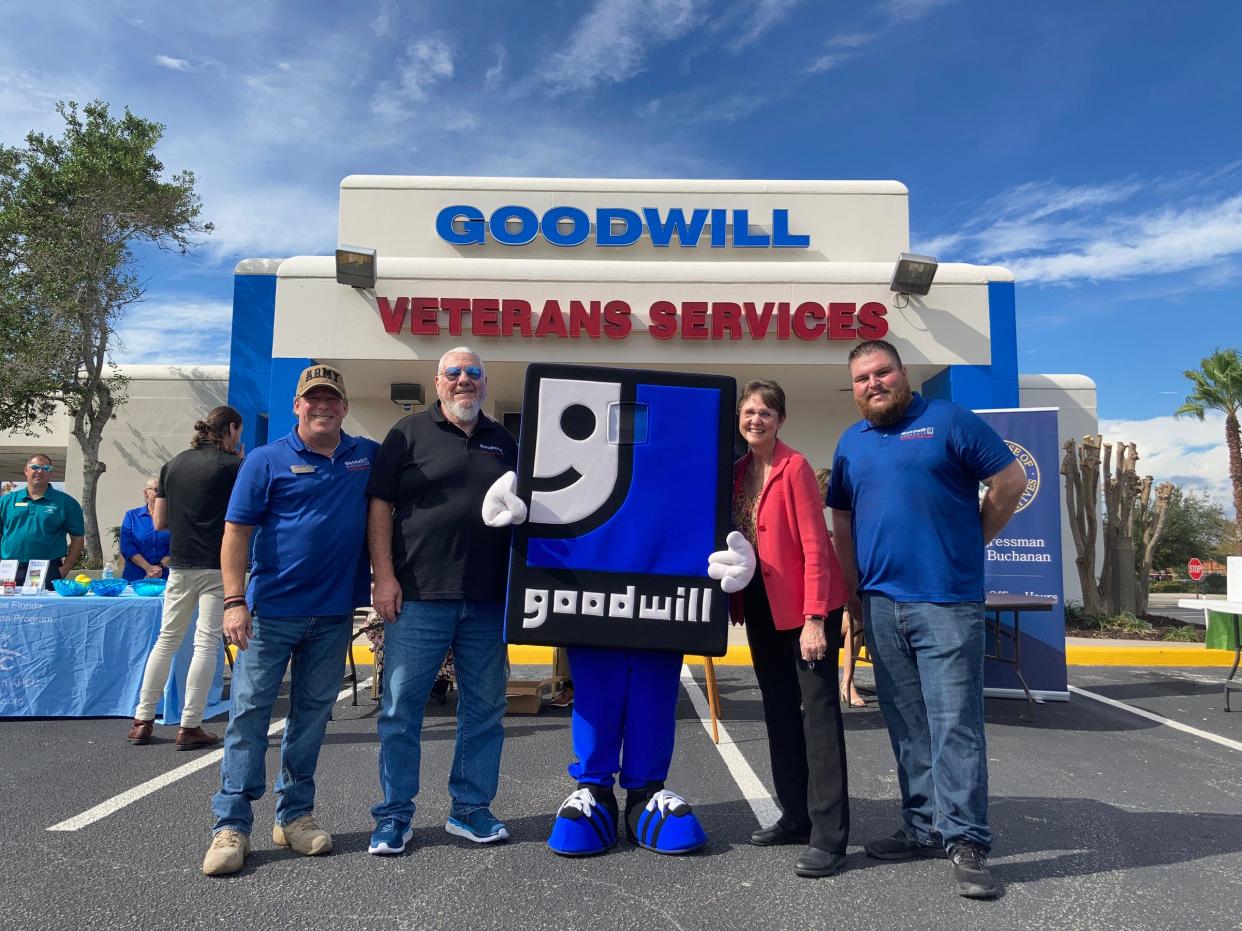 Goodwill Manasota will present a Veterans Resource Fair on Friday starting at 10 a.m. From left, Goodwill Manasota team members Randy Wright, Richard Burger, mascot Goodwilly, vice president Margie Genter, and Veterans Services program manager Todd Hughes.
