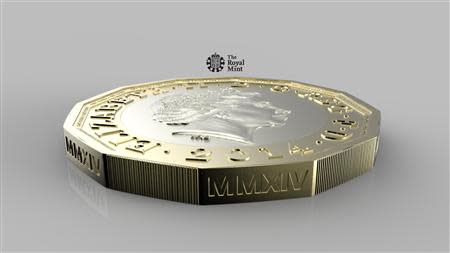 The new British 1-pound coin is seen in this undated handout photo from HM Treasury. Britain plans to replace its 1-pound coin in 2017 with "the most secure coin in circulation in the world" as it cracks down on fake currency. REUTERS/HM Treasury/Handout