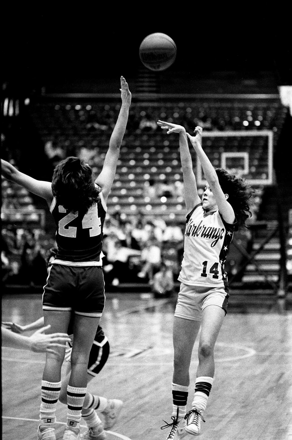 Clarkrange High sophomore guard Shawn Monday (14) gets her shot off against Rickman High sophomore Tonia Woolbright (24) during the TSSAA Class A state championship game at MTSU’s Murphy Center on March 17, 1984. Clarkrange won their second straight title with a 40-38 victory.