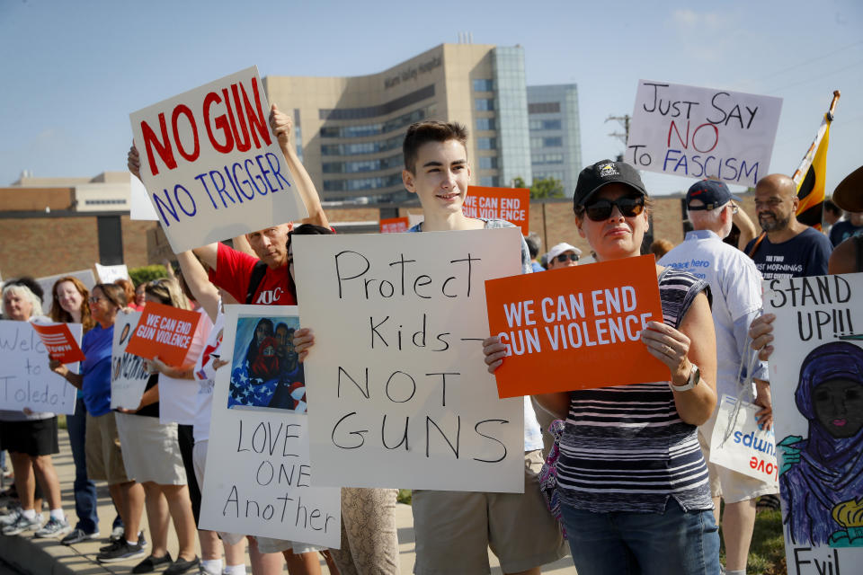 Demonstrators gather to protest the arrival of President Donald Trump outside Miami Valley Hospital after a mass shooting that occurred in the Oregon District early Sunday morning, Aug. 7, 2019, in Dayton. (Photo: John Minchillo/AP)