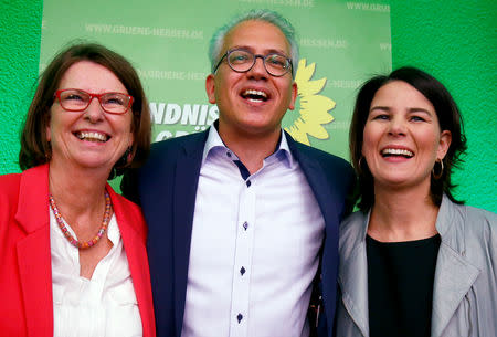 Green party top candidate and Minister of Economics, Energy, Transport and Regional Development of Hesse Tarek Al-Wazir, Minister For The Environment, Climate Protection, Agriculture And Consumer Protection Priska Hinz and Leader of the Green Party Annalena Baerbock react on first exit polls following the Hesse state election in Wiesbaden, Germany, October 28, 2018. REUTERS/Ralph Orlowski