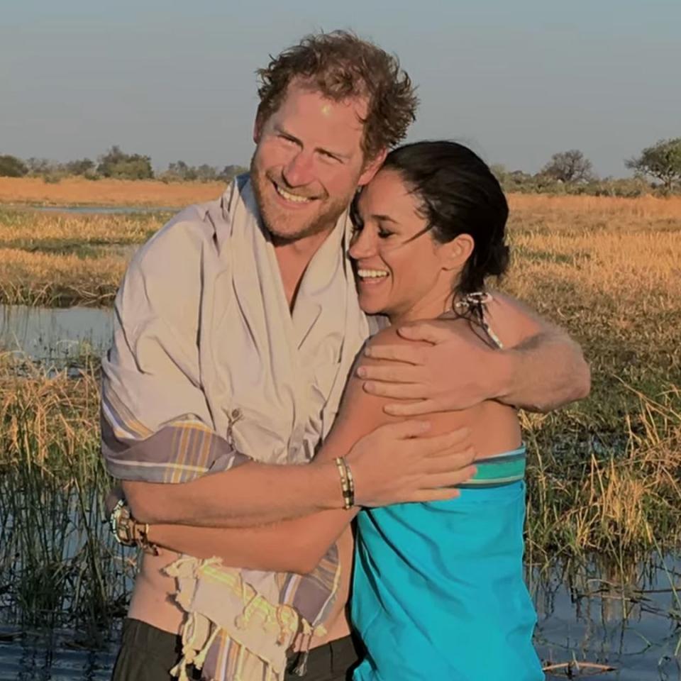 Prince Harry and Meghan Markle exchange kisses in romantic throwback holiday snaps