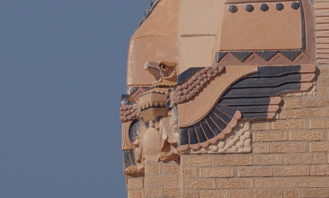 A terra-cotta bird statue sits on the North high tower. A total of 16 were made along with other statues nearly 100 years ago when the school was first built.