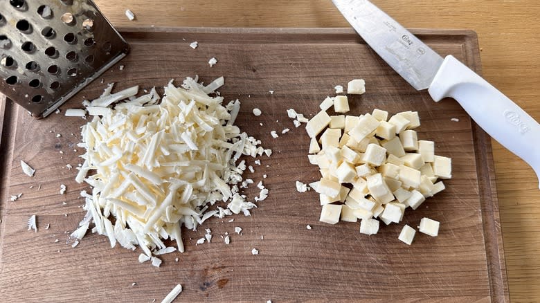 Grated and cubed Asiago cheese