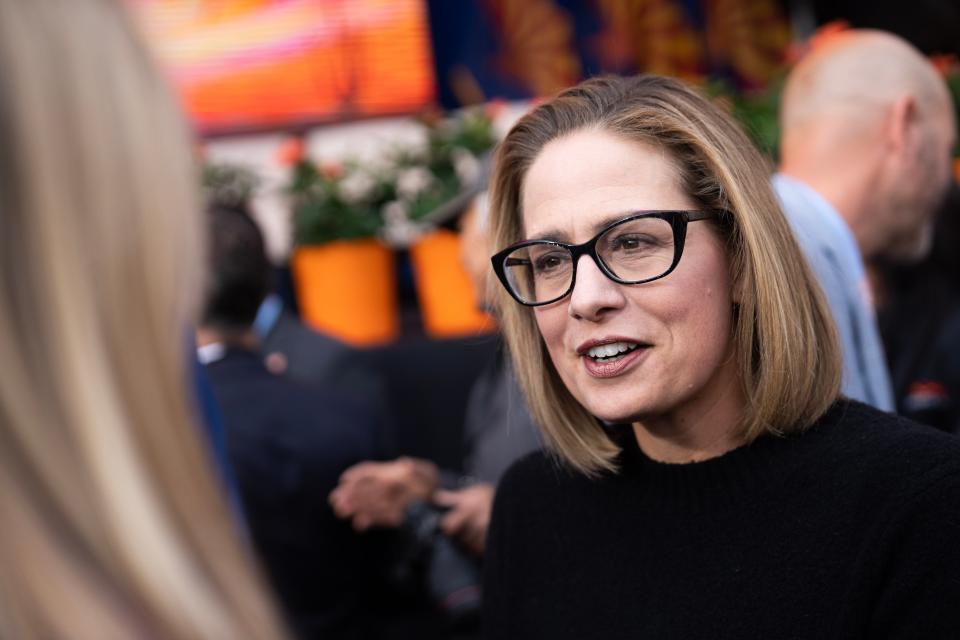 Arizona Sen. Kyrsten Sinema greets attendees during the public ceremonial inauguration ceremony for newly elected Arizona officials at the Arizona state Capitol on Jan. 5, 2023, in Phoenix.